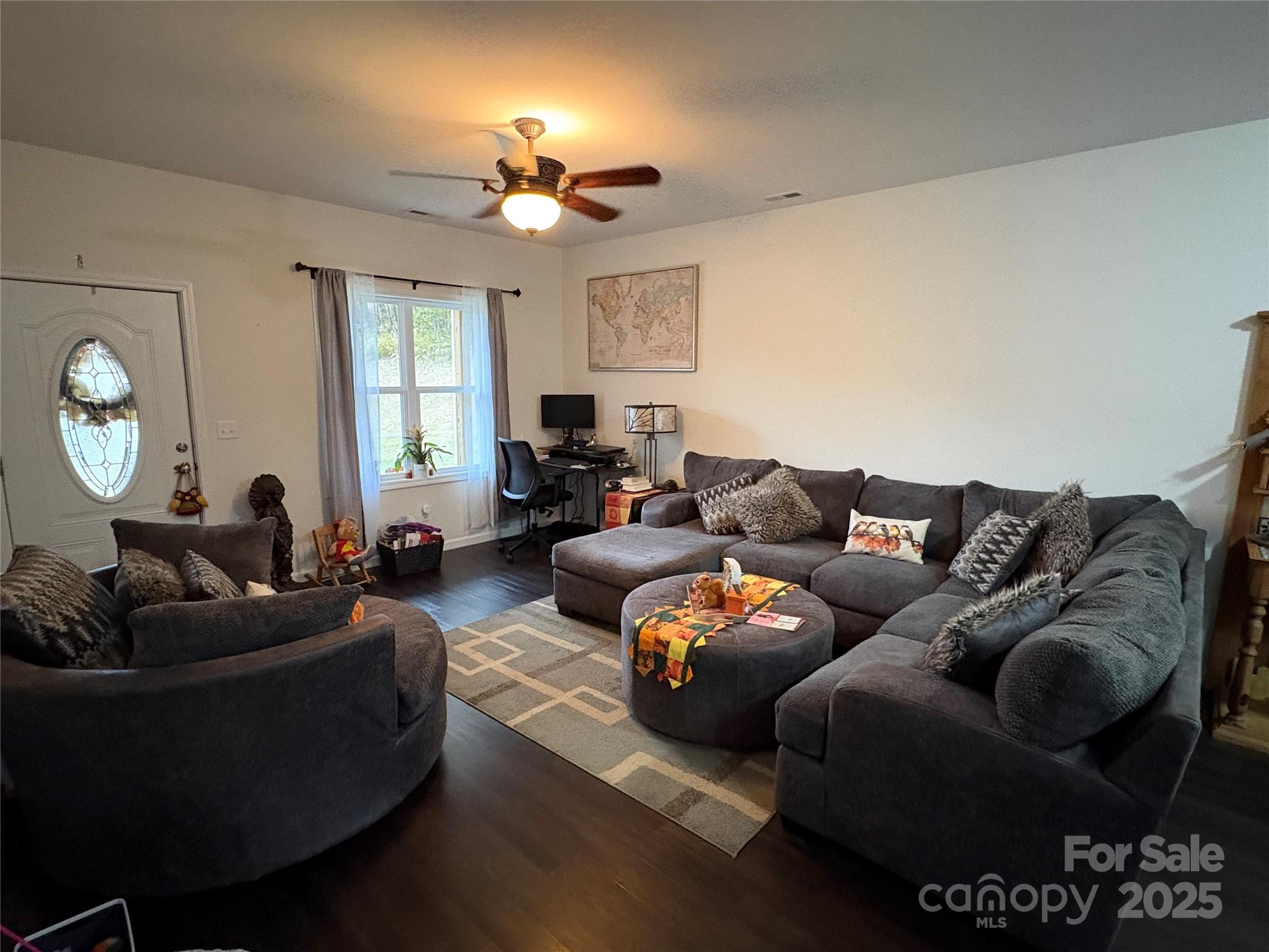 10 Scarlett Ridge Drive Marshall, NC 28753 - Photo 16 of 31 a living room with furniture a large window and a chandelier