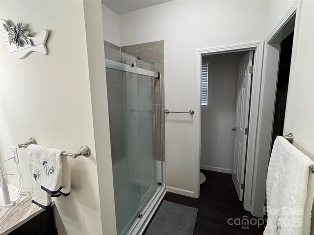 a bathroom with a tub and shower
