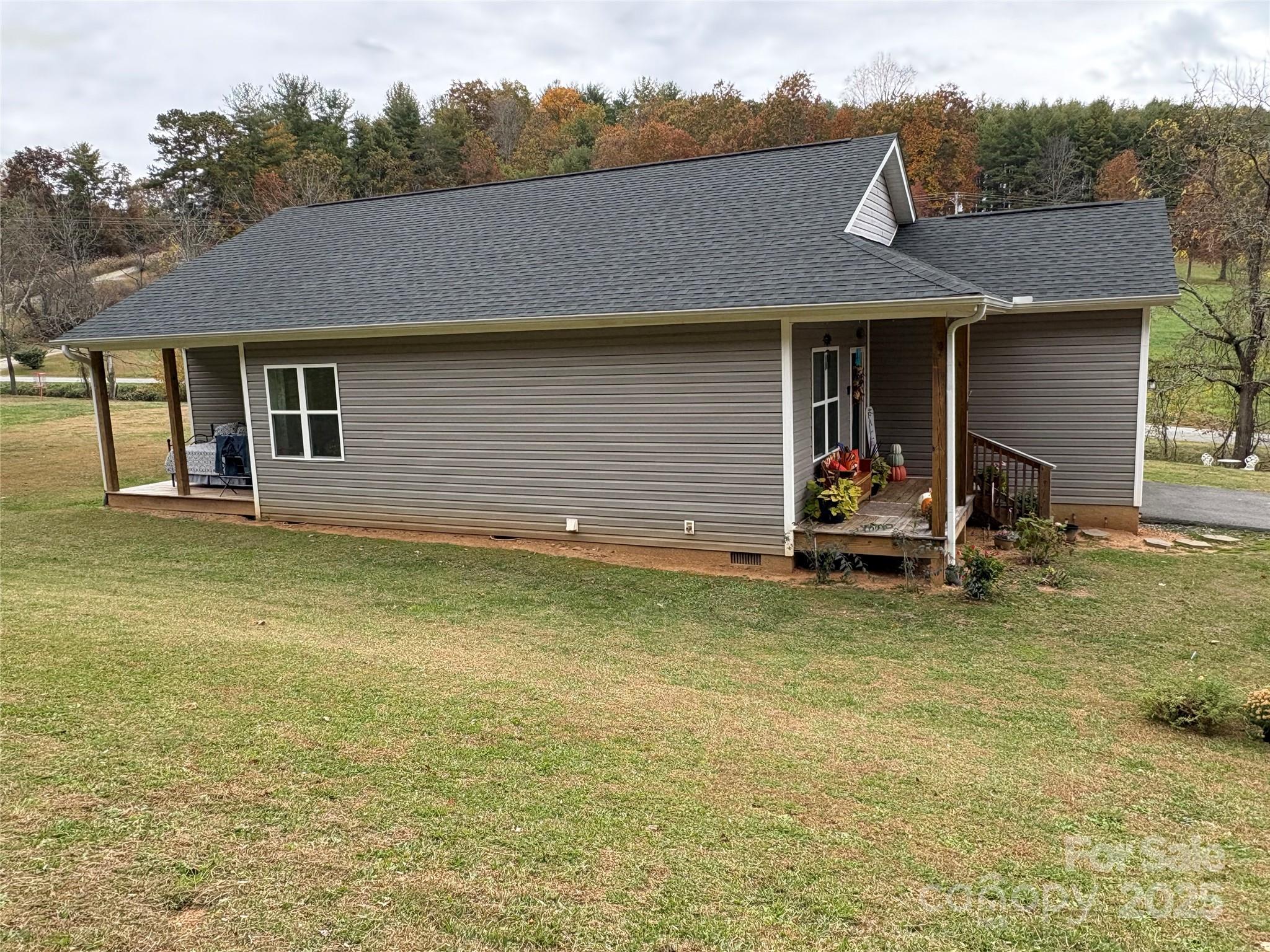 10 Scarlett Ridge Drive Marshall, NC 28753 - Photo 5 of 31 a view of a house with backyard and garden