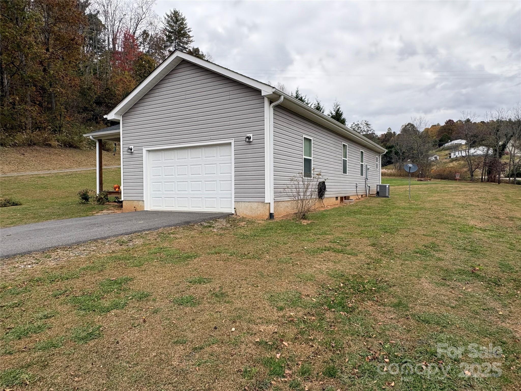10 Scarlett Ridge Drive Marshall, NC 28753 - Photo 6 of 31 a view of backyard of house and car parked