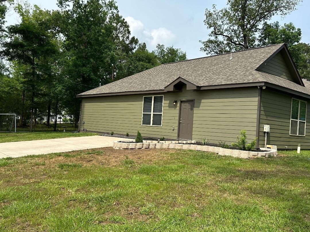 a house with yard in front of it