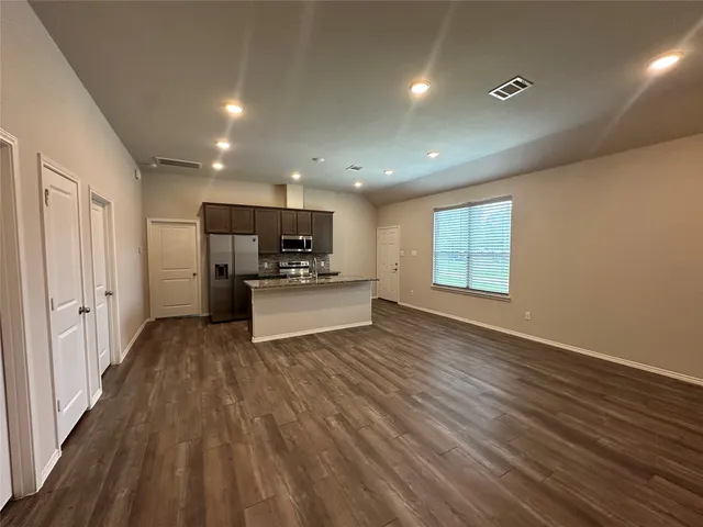 a view of kitchen and wooden floor
