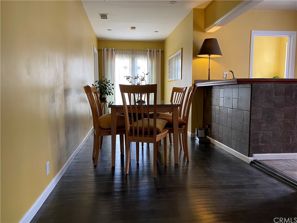 7548 Security Avenue Burbank, CA 91504 - Photo 16 of 41 a dining room with furniture and window