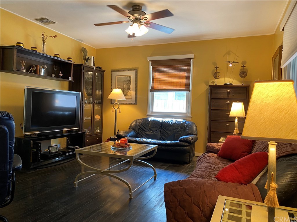 7548 Security Avenue Burbank, CA 91504 - Photo 27 of 41 a living room with furniture and a flat screen tv
