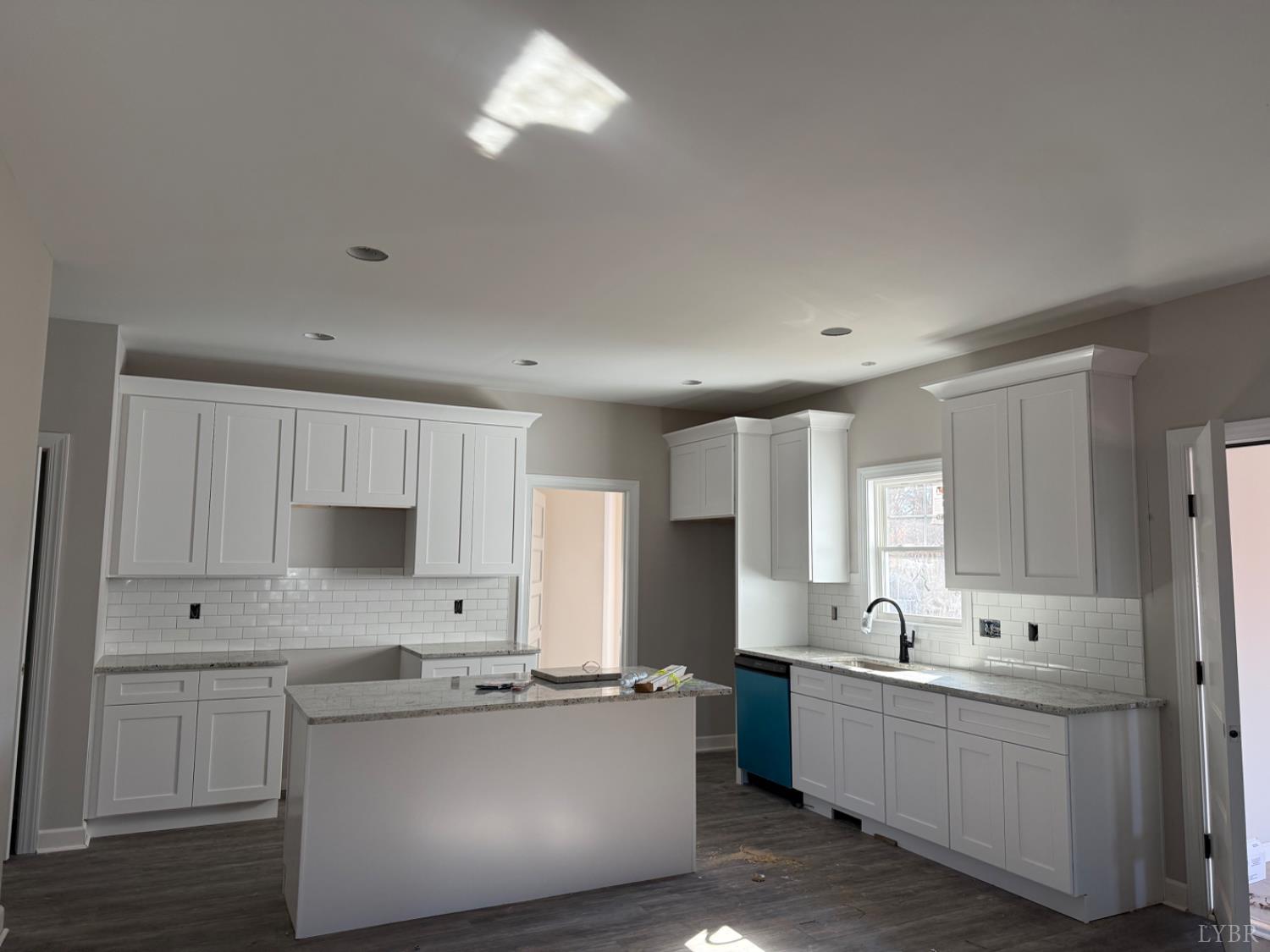 209 Spicer Road Lynchburg, VA 24504 - Photo 3 of 13 a kitchen with sink a microwave and cabinets