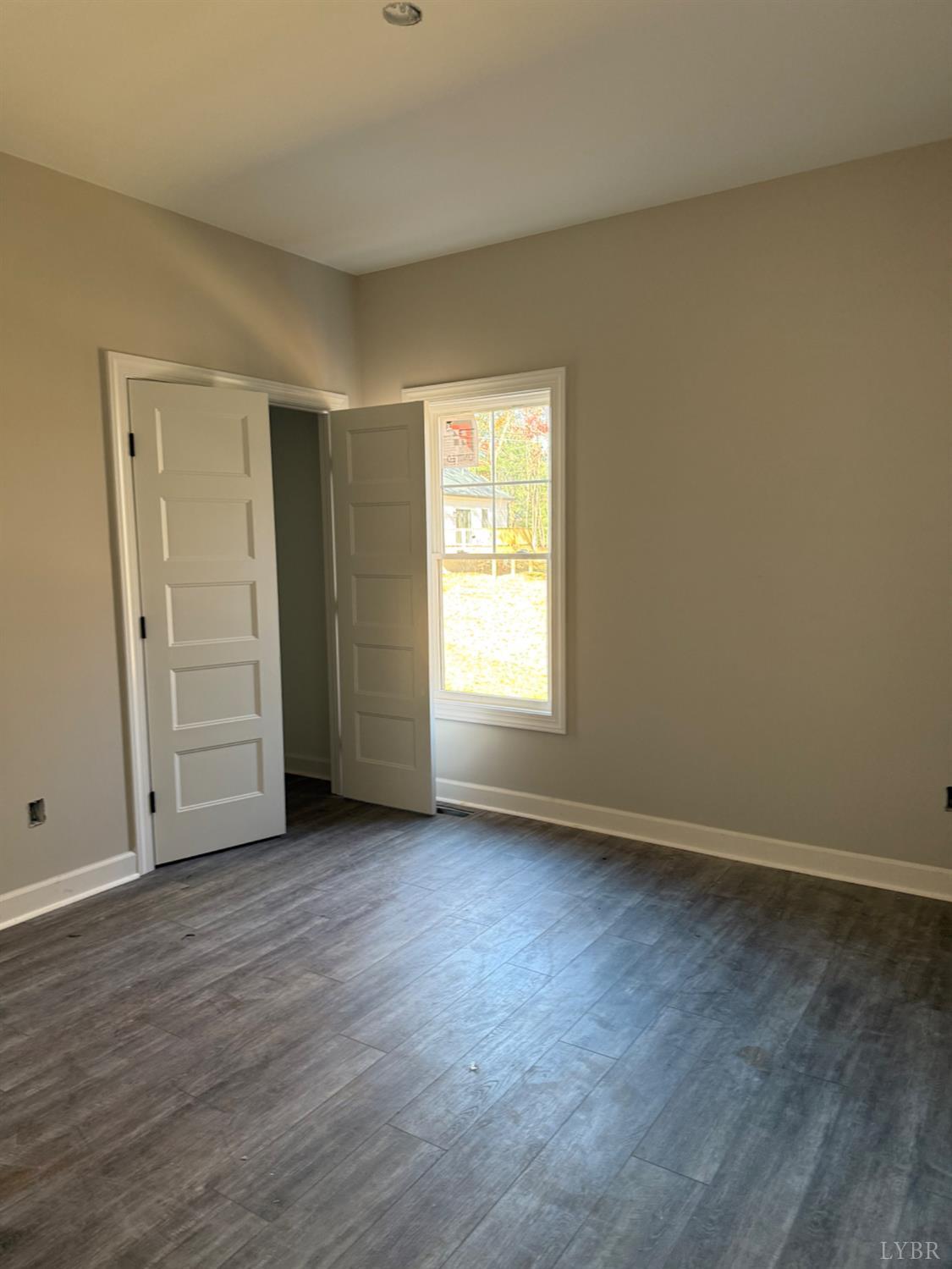 209 Spicer Road Lynchburg, VA 24504 - Photo 8 of 13 an empty room with wooden floor and closet