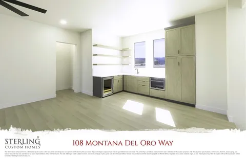 a large white kitchen with cabinets and a wooden floor
