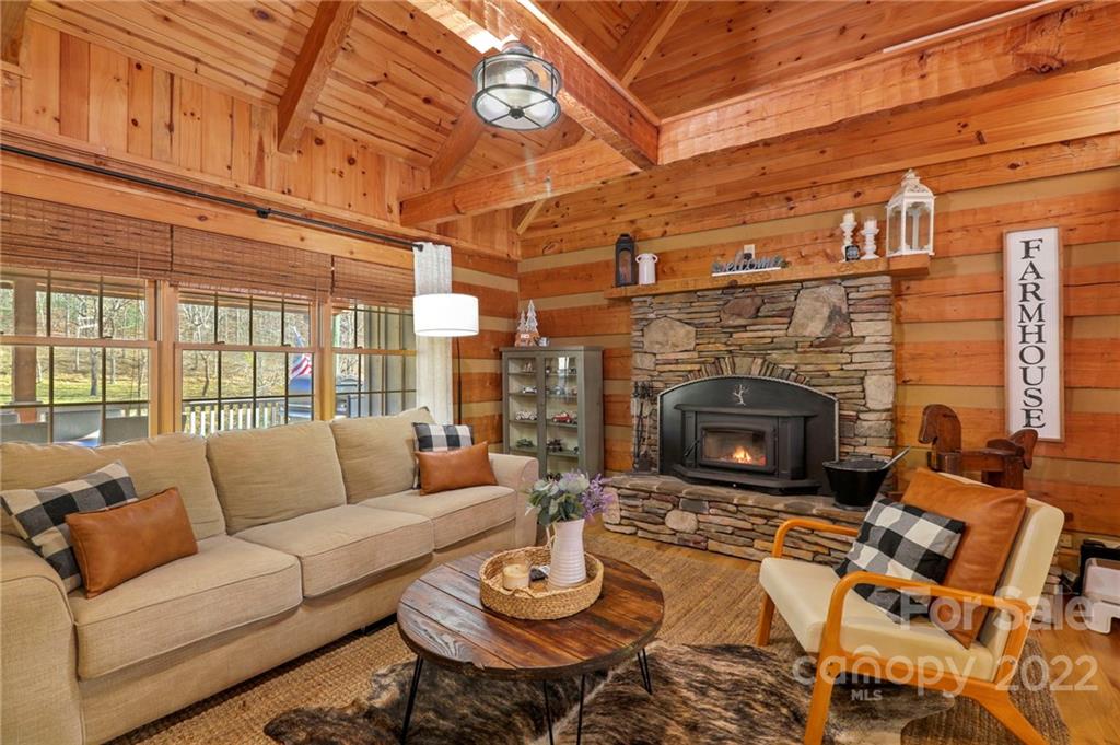 431 Silas Creek Road, Unit 4 Lansing, NC 28643 - Photo 14 of 46 a living room with furniture a fireplace and a table
