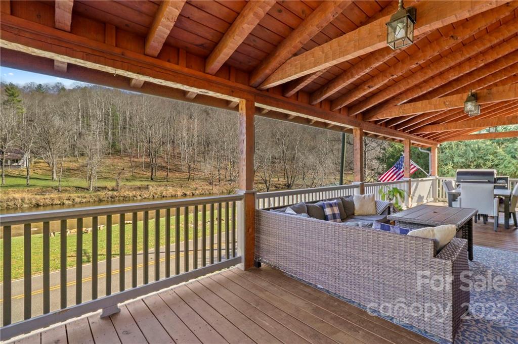 431 Silas Creek Road, Unit 4 Lansing, NC 28643 - Photo 17 of 46 a roof deck with couch and chairs