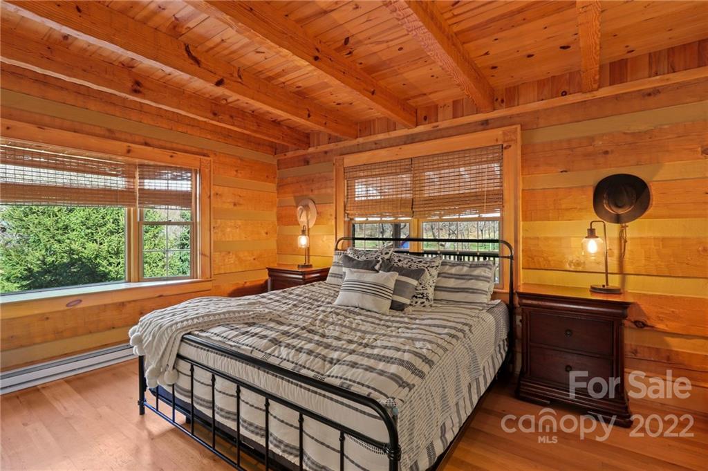 431 Silas Creek Road, Unit 4 Lansing, NC 28643 - Photo 21 of 46 a bedroom with a bed and a large window