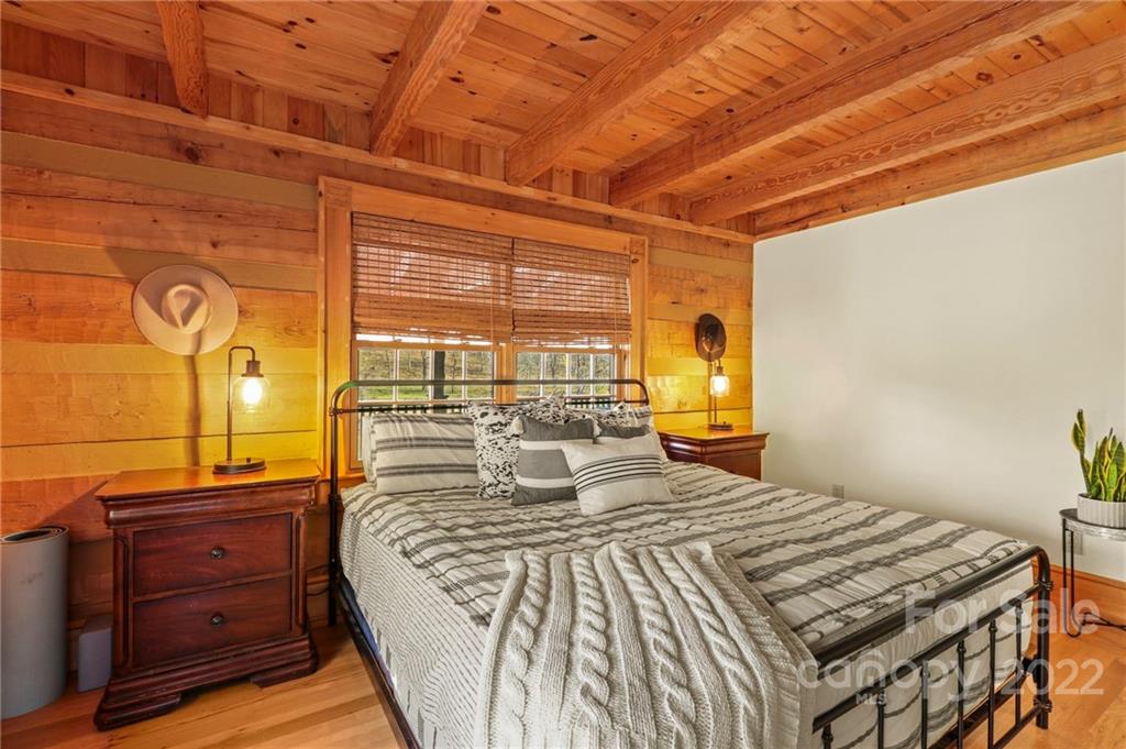 431 Silas Creek Road, Unit 4 Lansing, NC 28643 - Photo 22 of 46 a bedroom with a bed and a window