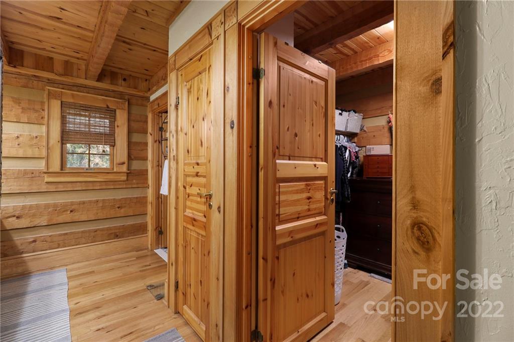 431 Silas Creek Road, Unit 4 Lansing, NC 28643 - Photo 23 of 46 a view of walk in closet with clothes