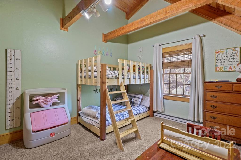 431 Silas Creek Road, Unit 4 Lansing, NC 28643 - Photo 28 of 46 a bedroom with a bed and a window