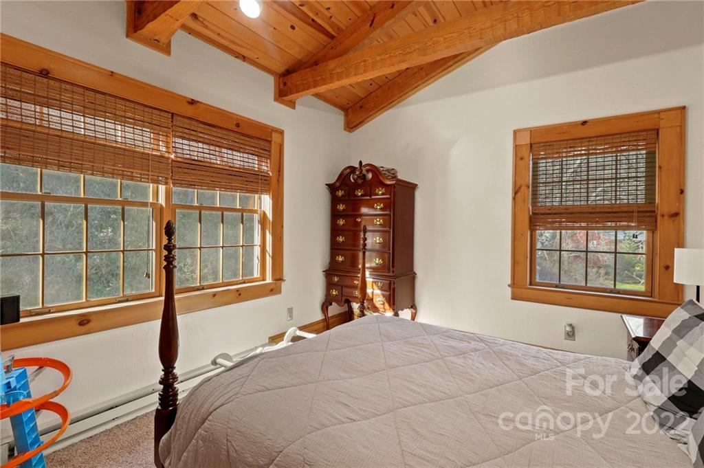 431 Silas Creek Road, Unit 4 Lansing, NC 28643 - Photo 30 of 46 a bedroom with a bed and a window