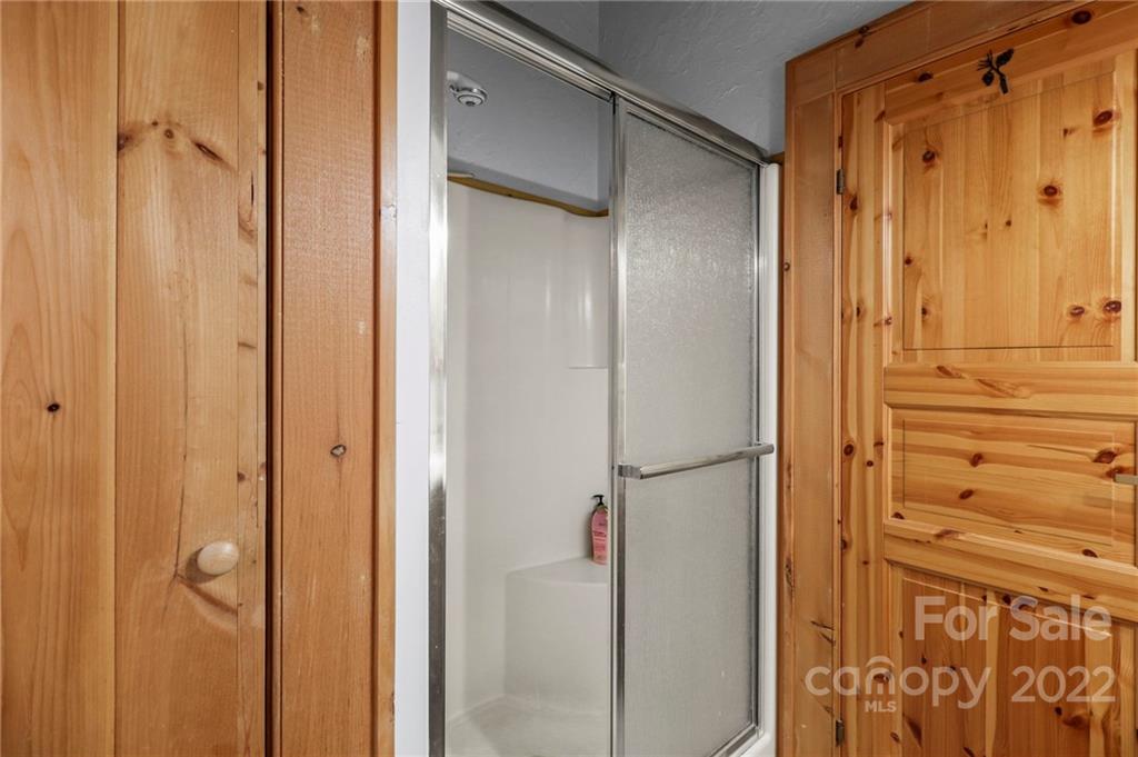 431 Silas Creek Road, Unit 4 Lansing, NC 28643 - Photo 33 of 46 a bathroom with a shower and a glass door