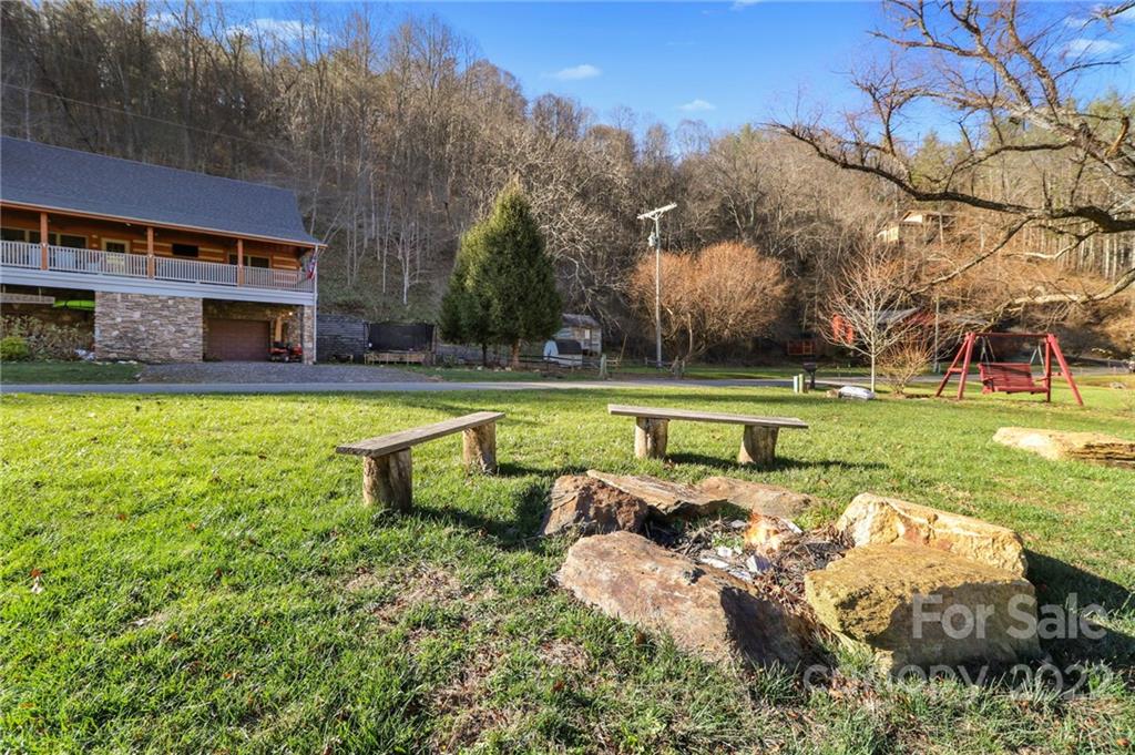 431 Silas Creek Road, Unit 4 Lansing, NC 28643 - Photo 42 of 46 a view of a house with pool and a yard