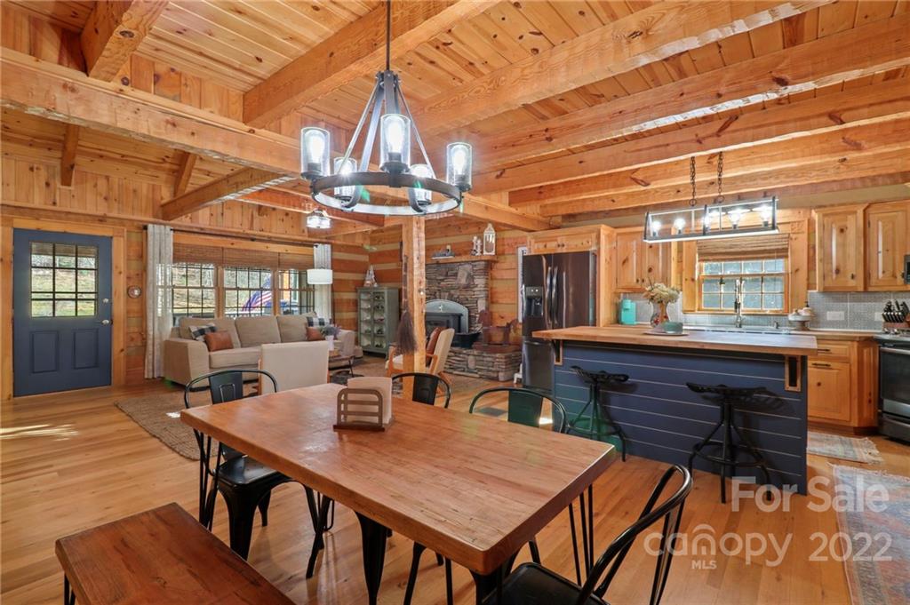 431 Silas Creek Road, Unit 4 Lansing, NC 28643 - Photo 6 of 46 a dining room with a wooden table and chairs