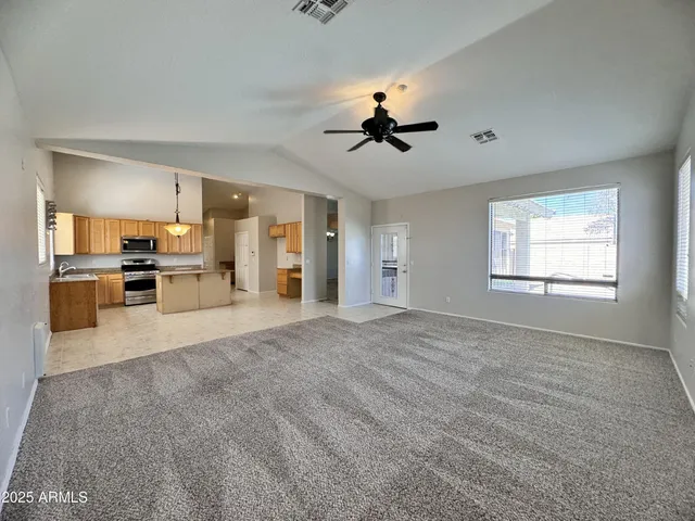 a view of a kitchen with furniture and a window