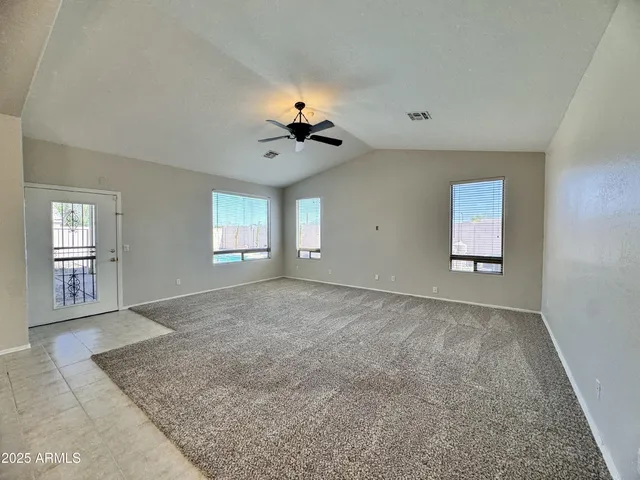 a view of empty room with windows
