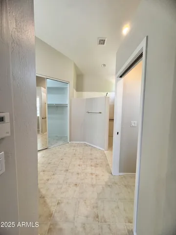 a large bathroom with a shower and a sink
