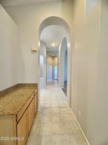a bathroom with a double vanity sink toilet and shower