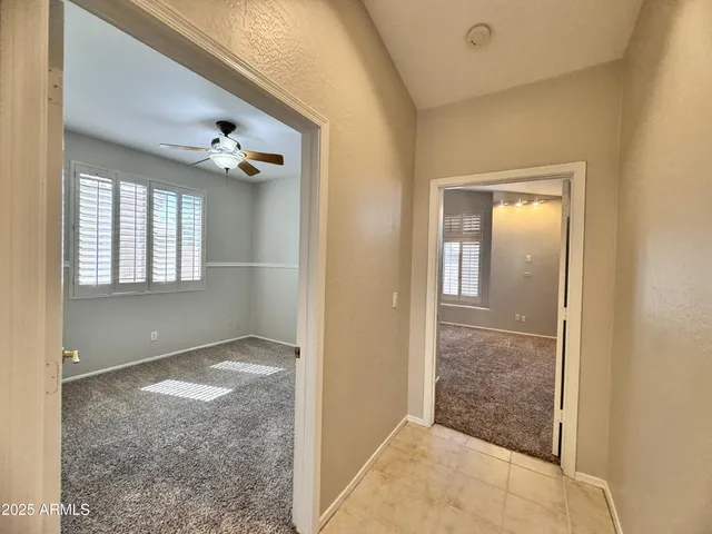 a view of a house with backyard porch and sitting area