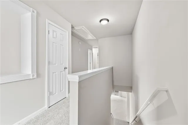 a view of a hallway with staircase