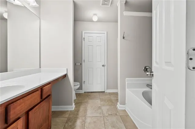 a bathroom with a bathtub and a sink