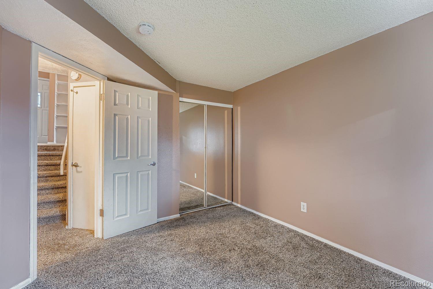 17365 East Rice Circle, Unit A Aurora, CO 80015 - Photo 10 of 18 a view of entryway with stairs