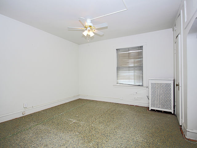 2005 Darrow Avenue Evanston, IL 60201 - Photo 15 of 24 an empty room with chandelier fan