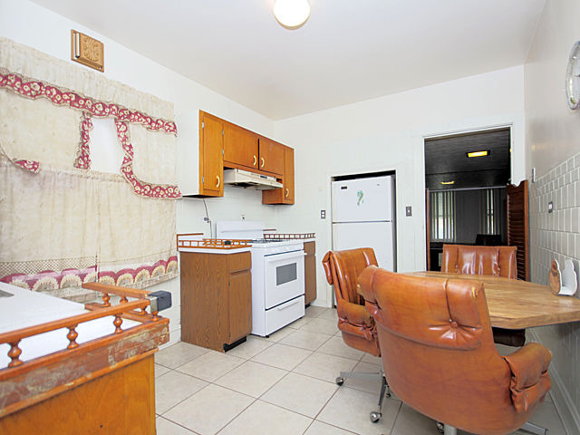 2005 Darrow Avenue Evanston, IL 60201 - Photo 10 of 24 a kitchen with stainless steel appliances kitchen island granite countertop a sink and cabinets