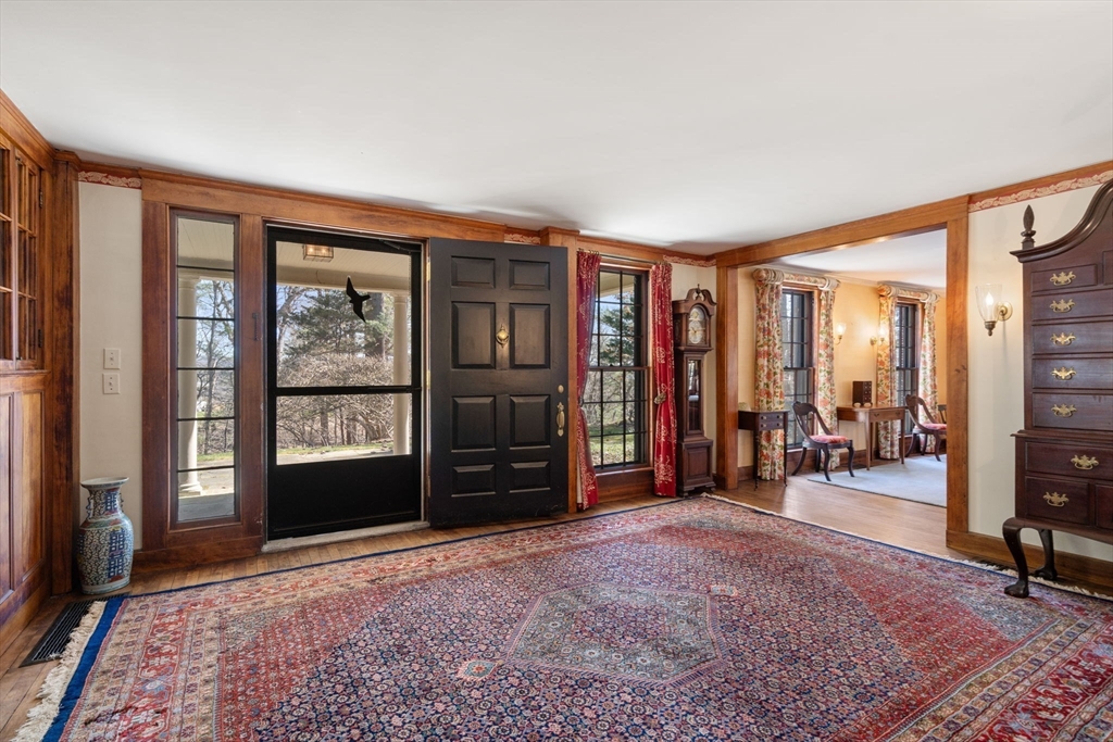 83 Webster Road Weston, MA 02493 - Photo 4 of 24 an empty room with furniture and a floor to ceiling window
