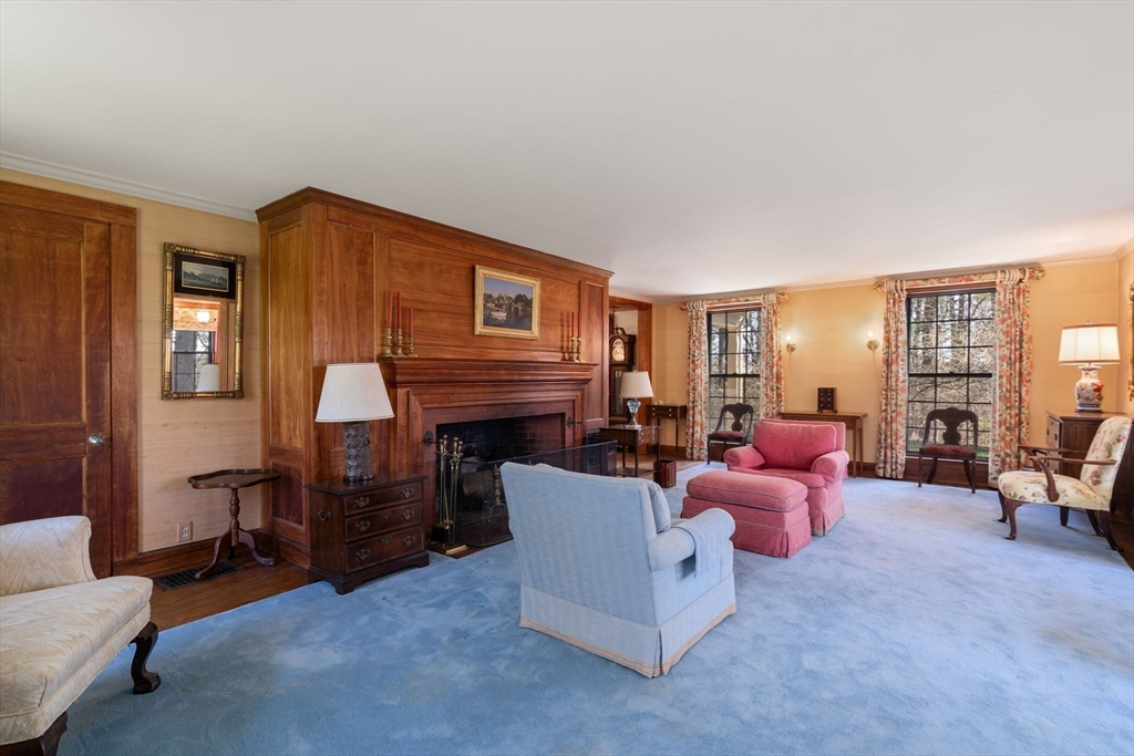 83 Webster Road Weston, MA 02493 - Photo 9 of 24 a living room with furniture and a fireplace