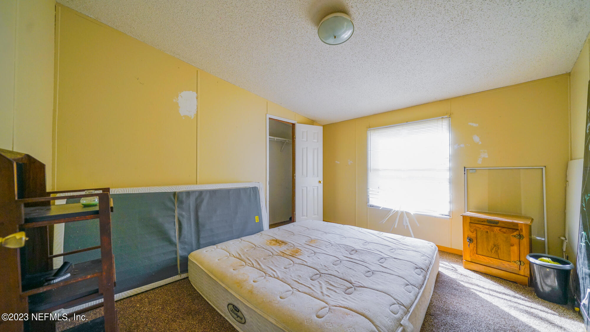 16055 Shellcracker Road Jacksonville, FL 32226 - Photo 13 of 32 a bedroom with a bed and wooden floor
