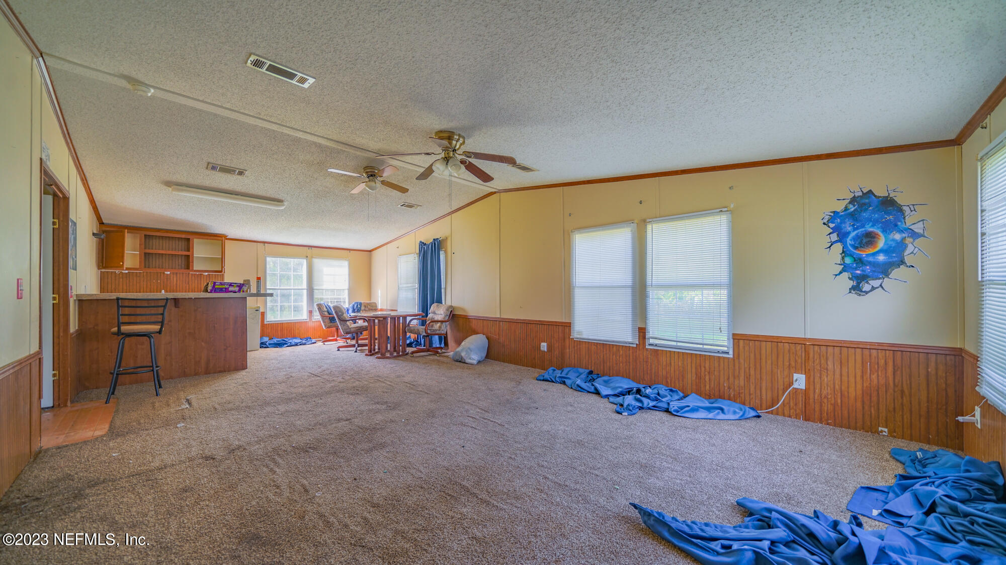 16055 Shellcracker Road Jacksonville, FL 32226 - Photo 16 of 32 a view of a room with gym equipment and a large window