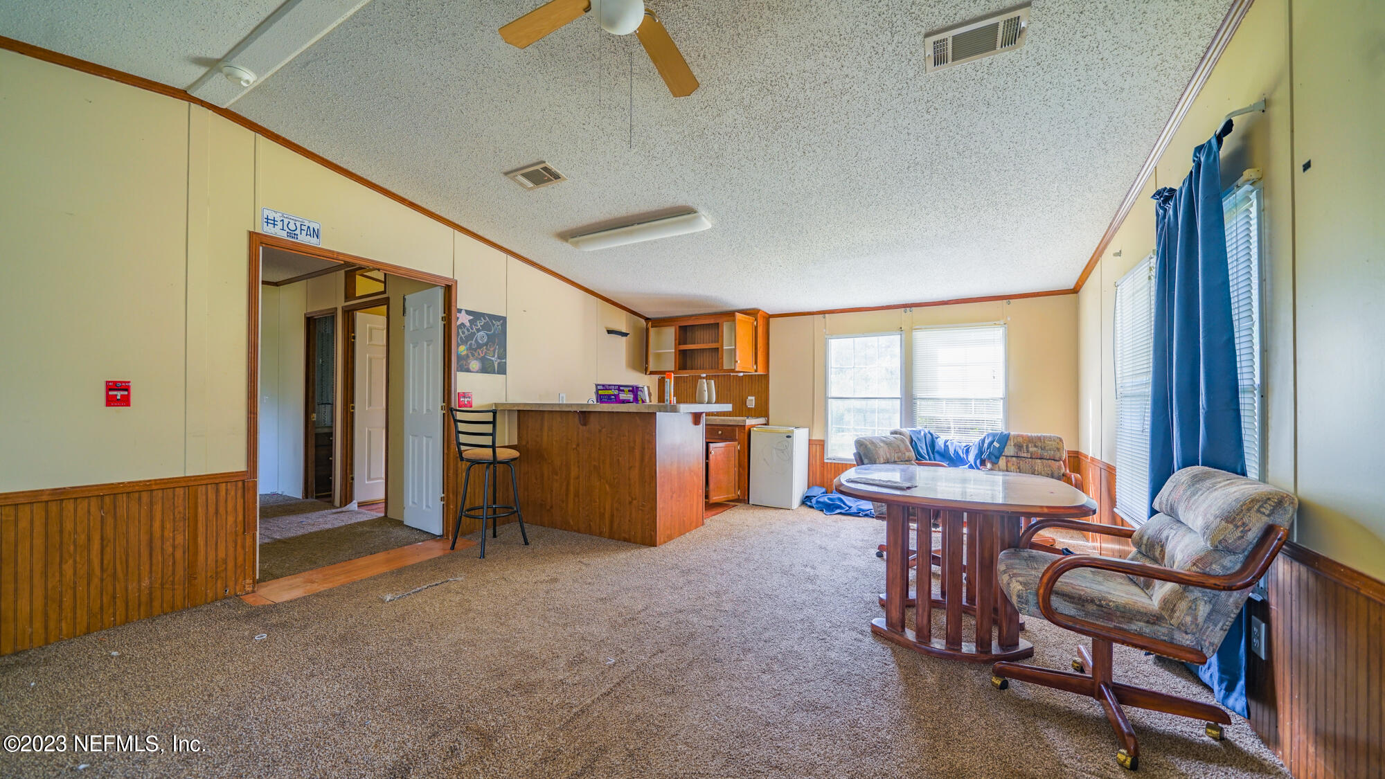 16055 Shellcracker Road Jacksonville, FL 32226 - Photo 17 of 32 a dining room with furniture and a window