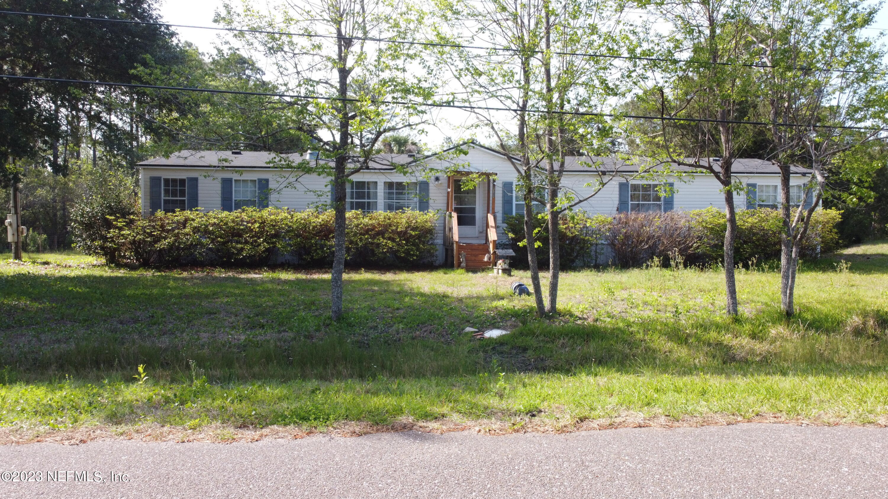 16055 Shellcracker Road Jacksonville, FL 32226 - Photo 19 of 32 a front view of a house with a yard and green space