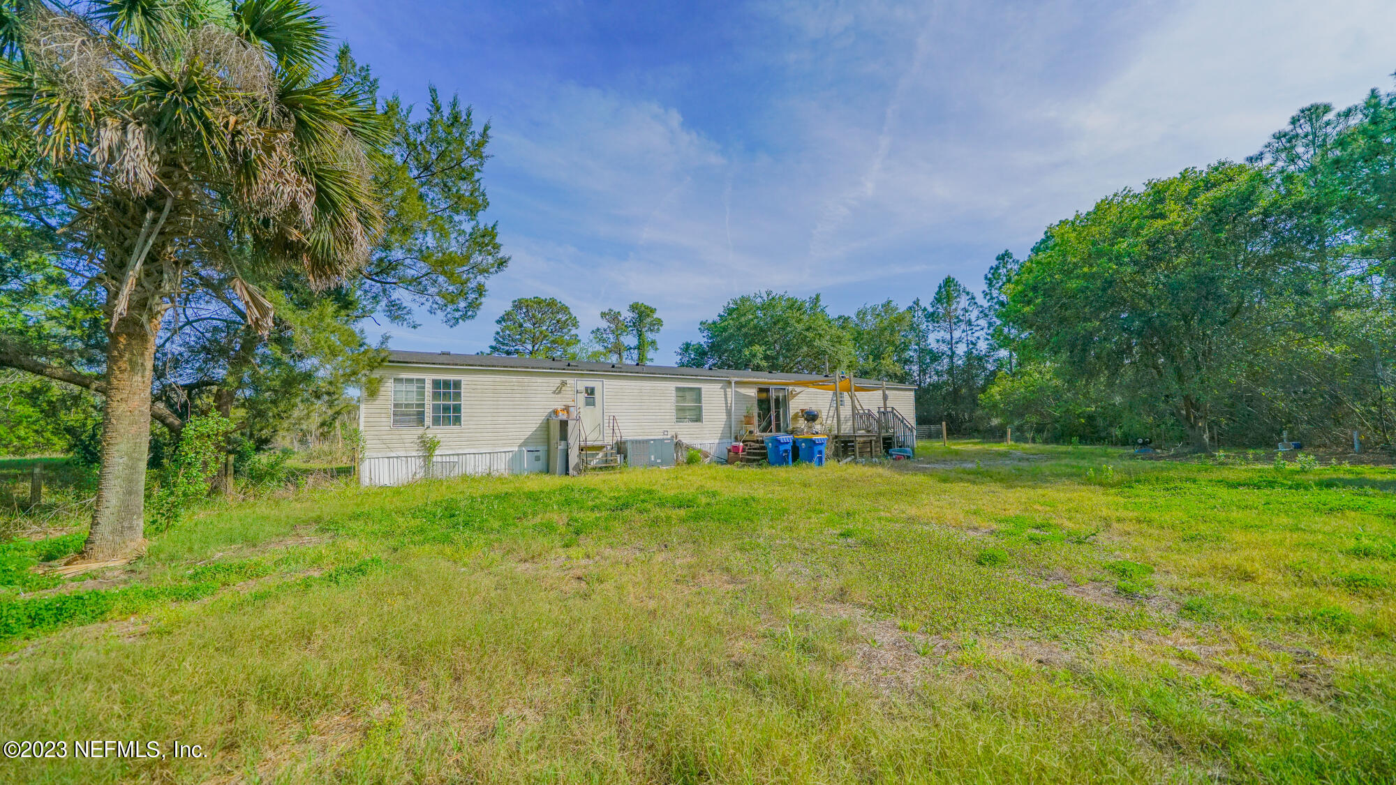 16055 Shellcracker Road Jacksonville, FL 32226 - Photo 27 of 32 a front view of a house with a yard and trees