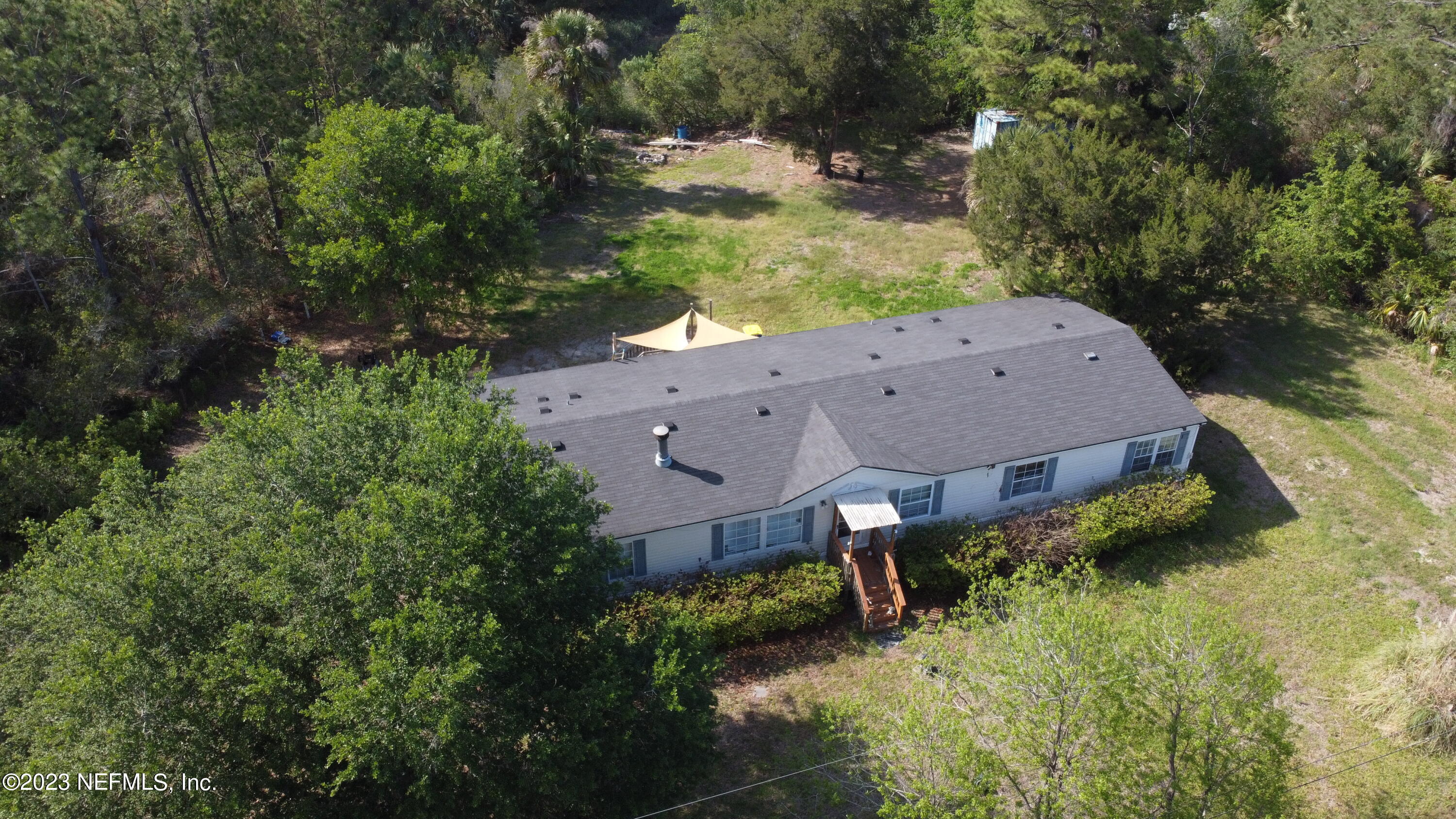16055 Shellcracker Road Jacksonville, FL 32226 - Photo 31 of 32 an aerial view of a house with a yard
