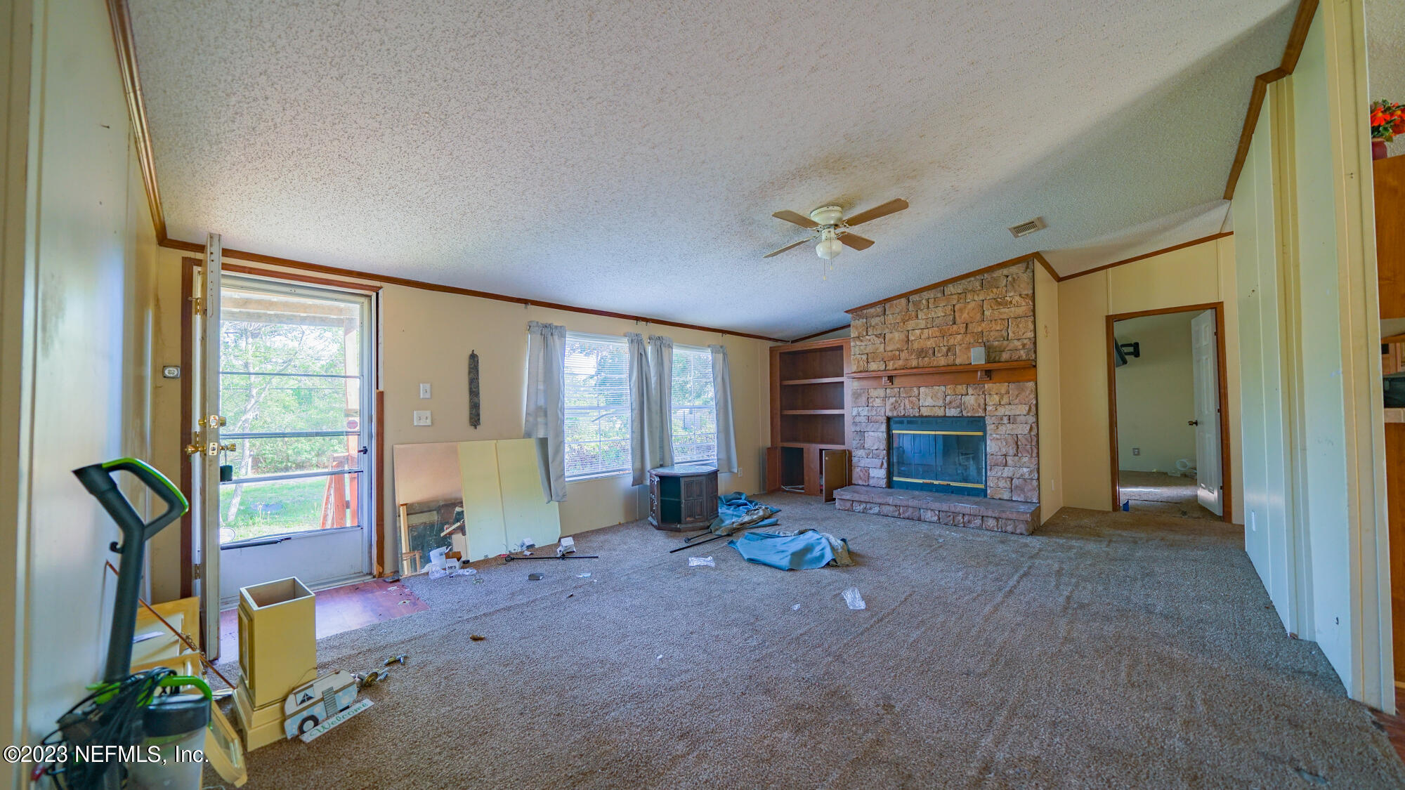16055 Shellcracker Road Jacksonville, FL 32226 - Photo 5 of 32 a view of a livingroom with furniture and a fireplace