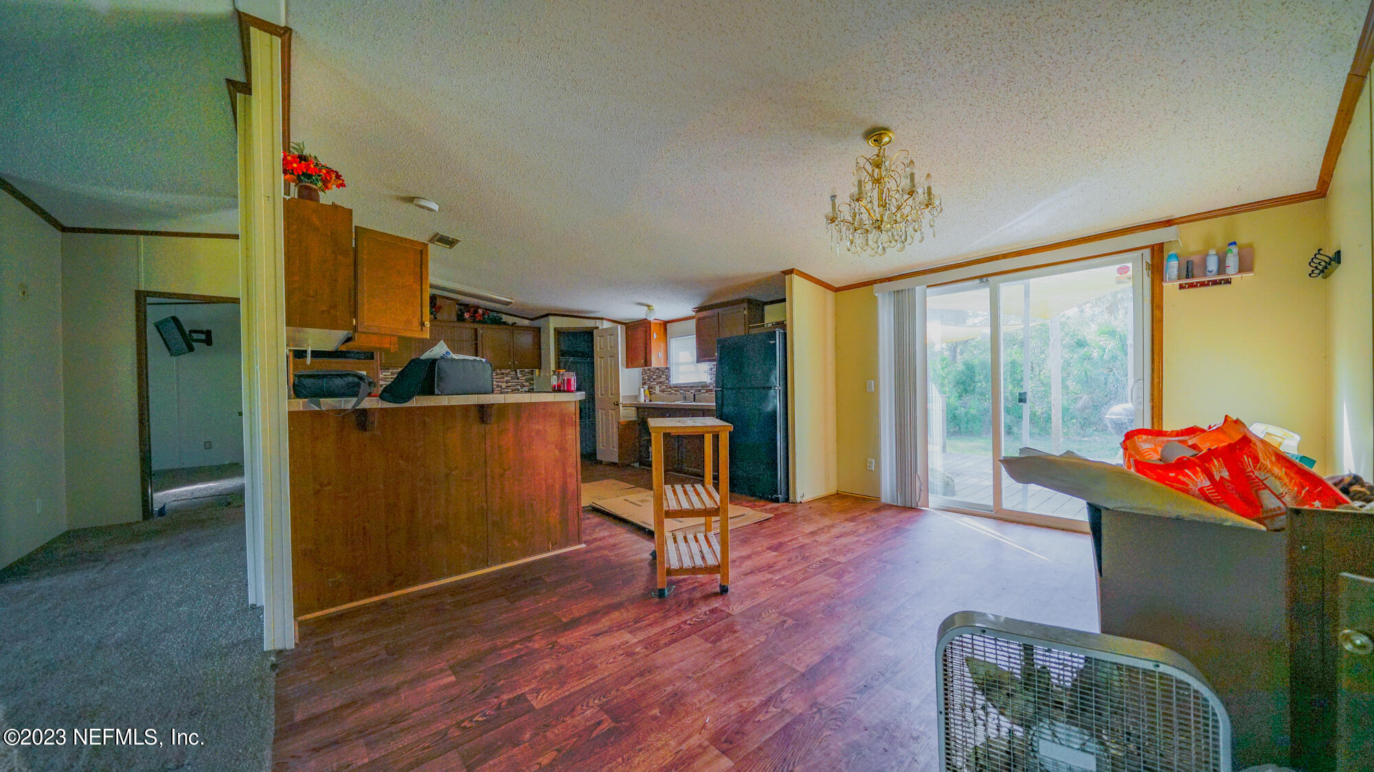 16055 Shellcracker Road Jacksonville, FL 32226 - Photo 6 of 32 a living room with furniture and a flat screen tv