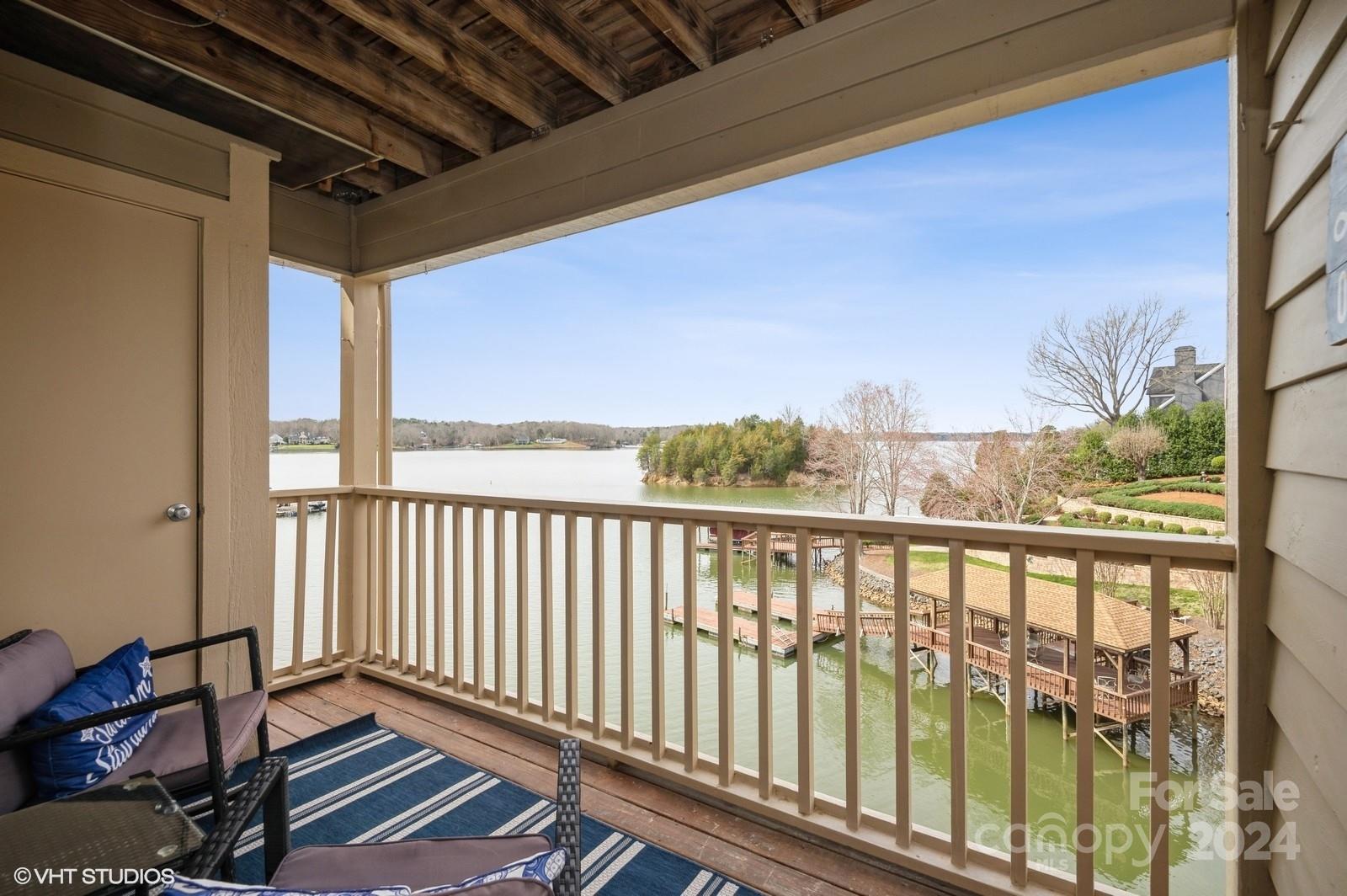 13822 Queens Harbor Road, Unit H Charlotte, NC 28278 - Photo 1 of 37 a view of a porch