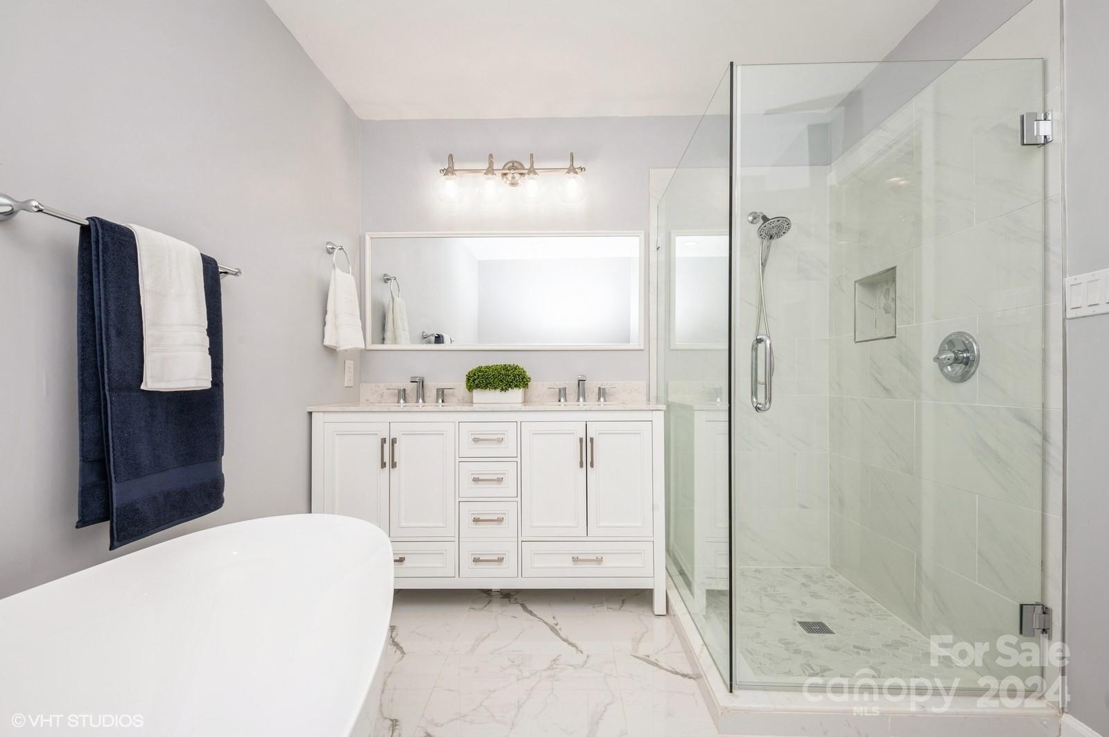13822 Queens Harbor Road, Unit H Charlotte, NC 28278 - Photo 20 of 37 a bathroom with a granite countertop sink a mirror a bathtub and shower