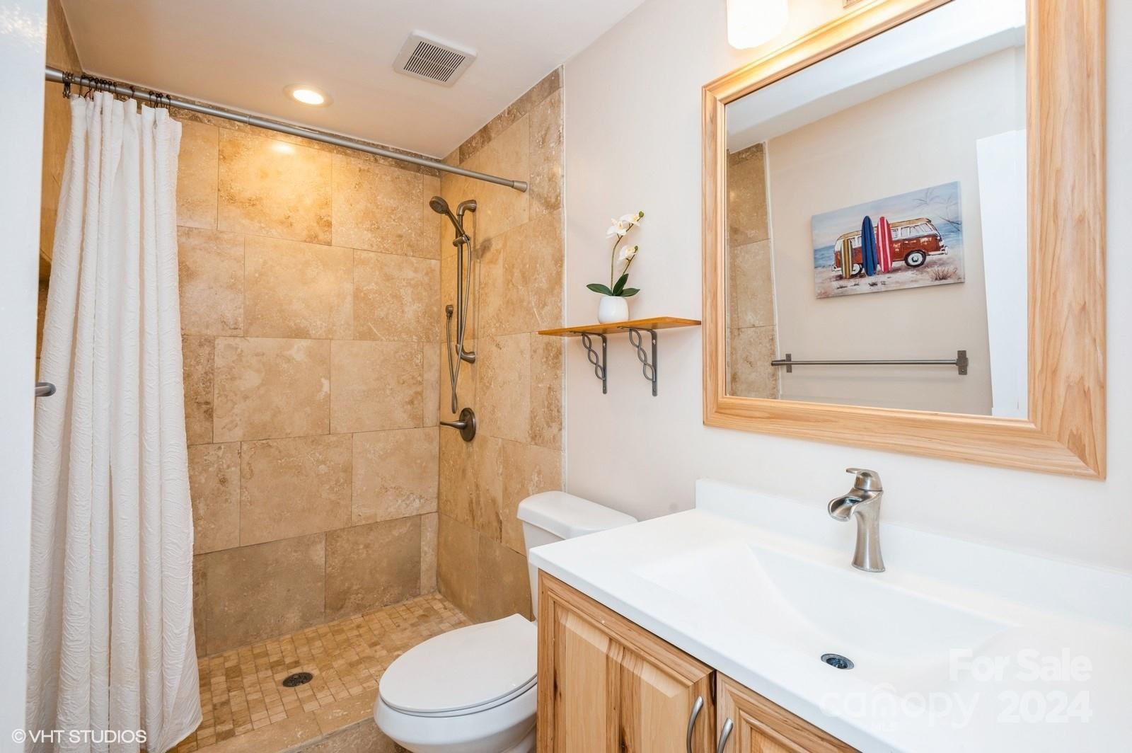 13822 Queens Harbor Road, Unit H Charlotte, NC 28278 - Photo 25 of 37 a bathroom with a sink toilet and shower