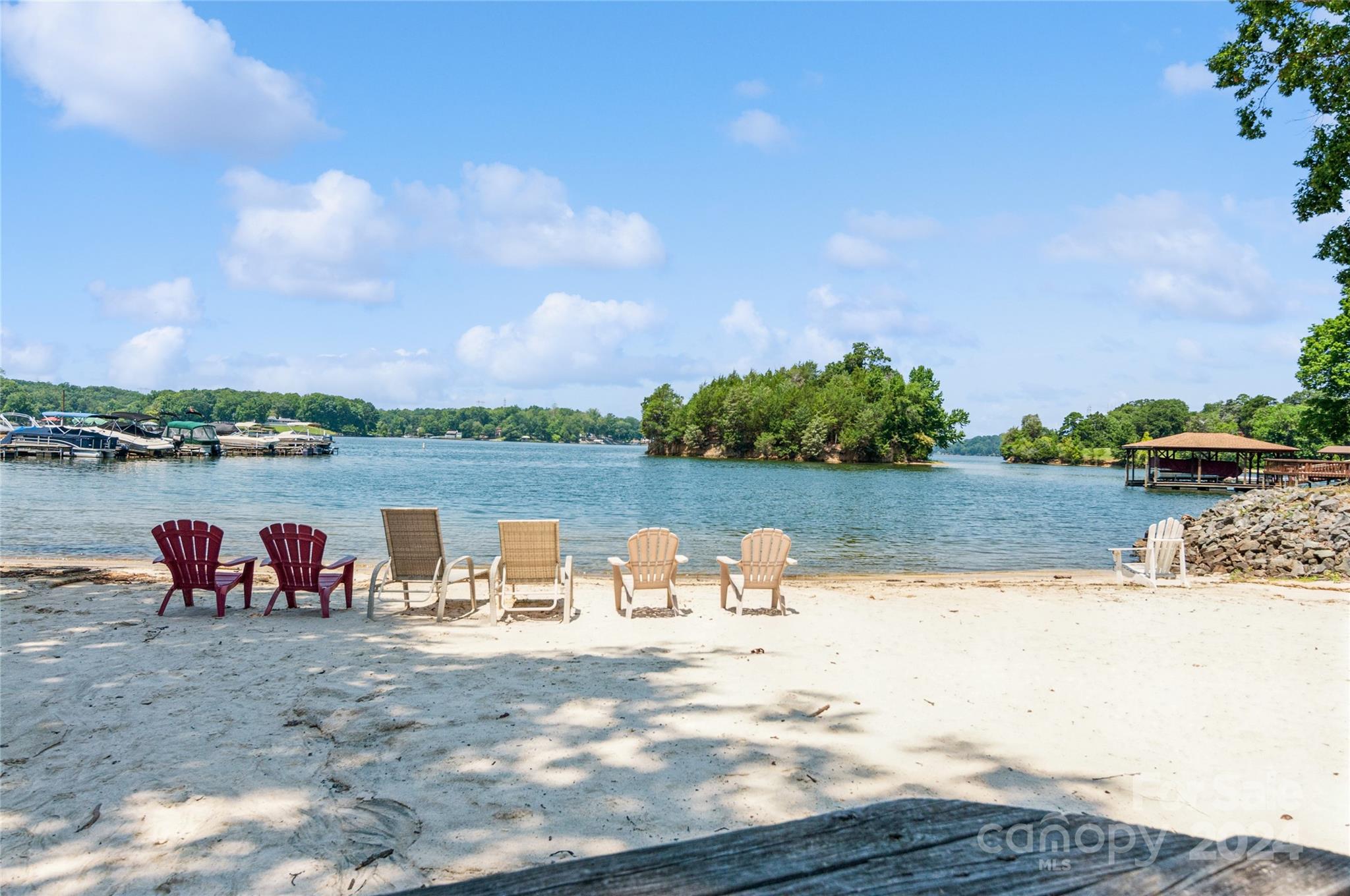 13822 Queens Harbor Road, Unit H Charlotte, NC 28278 - Photo 3 of 37 a view of a lake with houses with outdoor space