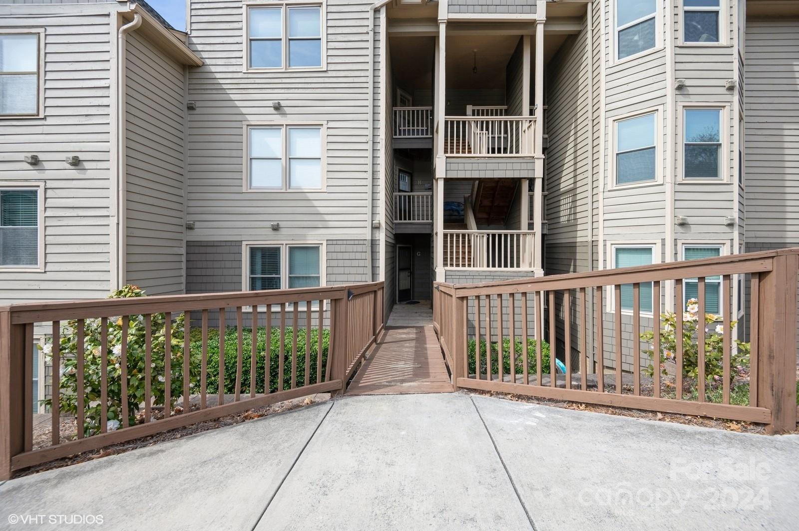 13822 Queens Harbor Road, Unit H Charlotte, NC 28278 - Photo 32 of 37 front view of a house
