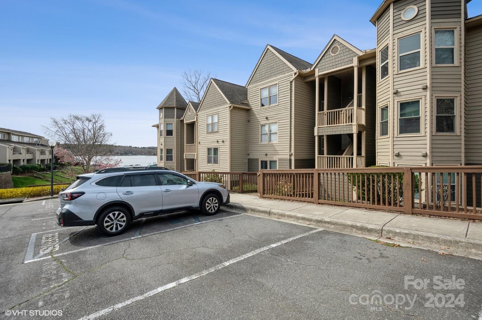 13822 Queens Harbor Road, Unit H Charlotte, NC 28278 - Photo 33 of 37 a view of a car parked in front of a house