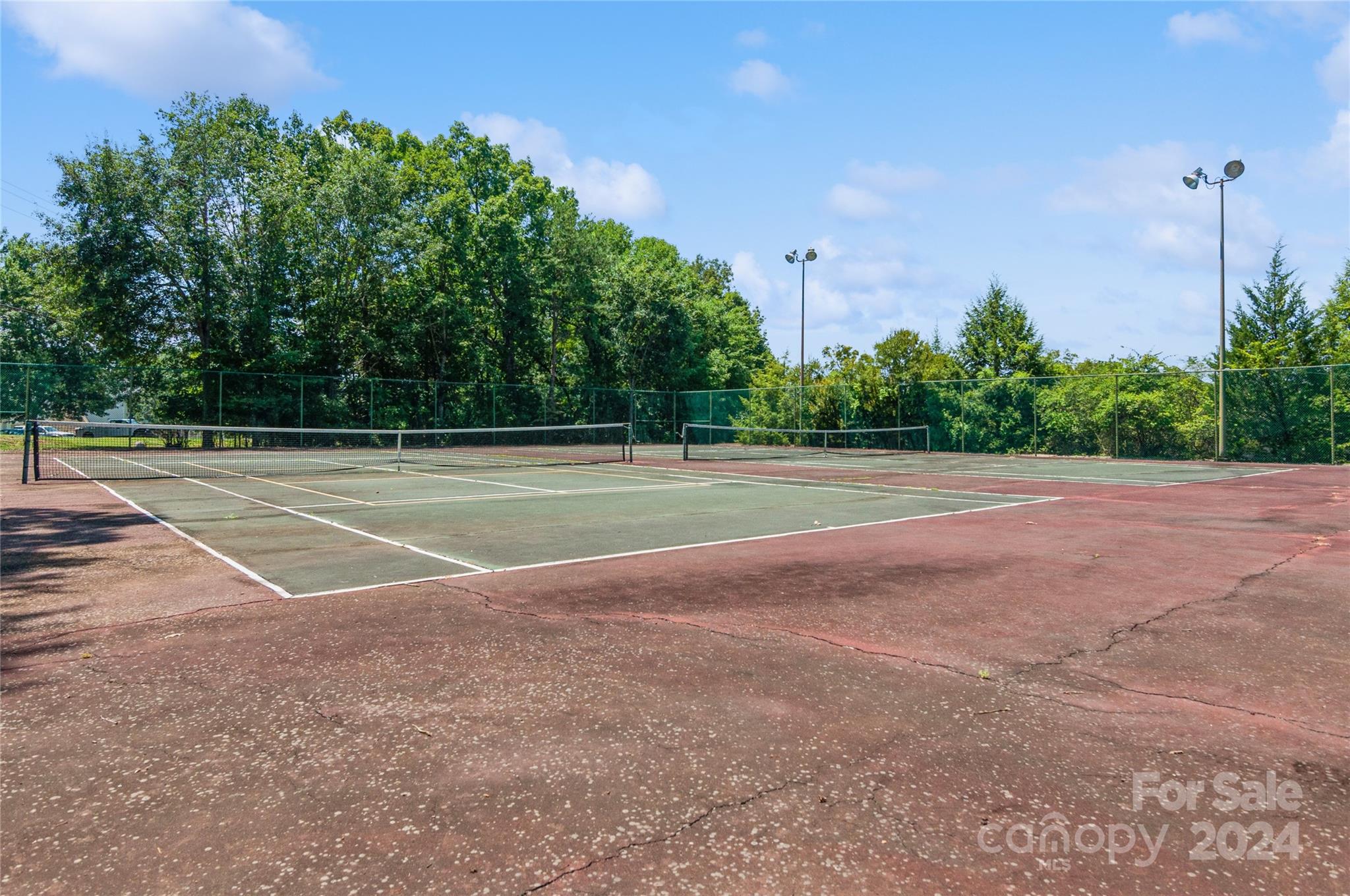 13822 Queens Harbor Road, Unit H Charlotte, NC 28278 - Photo 36 of 37 a view of a tennis court