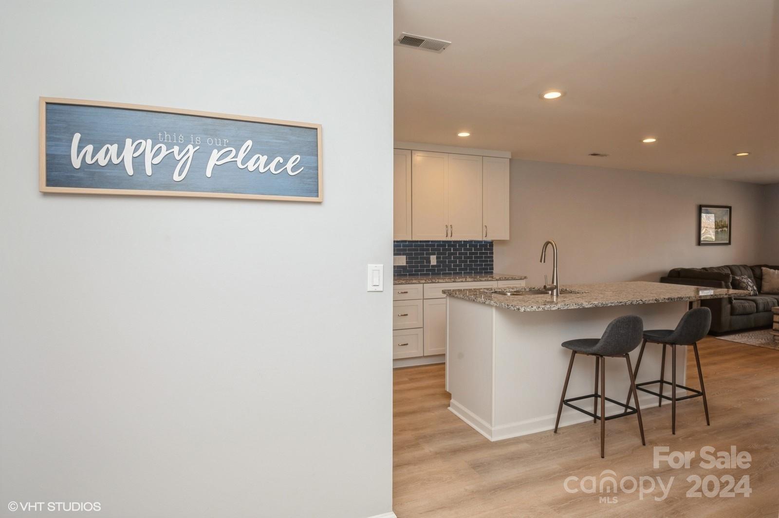 13822 Queens Harbor Road, Unit H Charlotte, NC 28278 - Photo 6 of 37 a view of kitchen with stainless steel appliances granite countertop a sink and a refrigerator