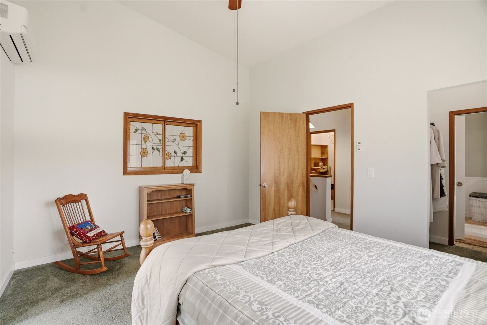 12119 South Spotted Road Cheney, WA 99004 - Photo 19 of 40 a bedroom with a bed and wooden floor